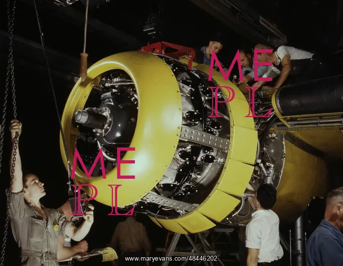: Workers mounting motor on a B-25 bomber plane, circa 1942 : Workers mounting motor on a B-25 bomber plane, circa 1942