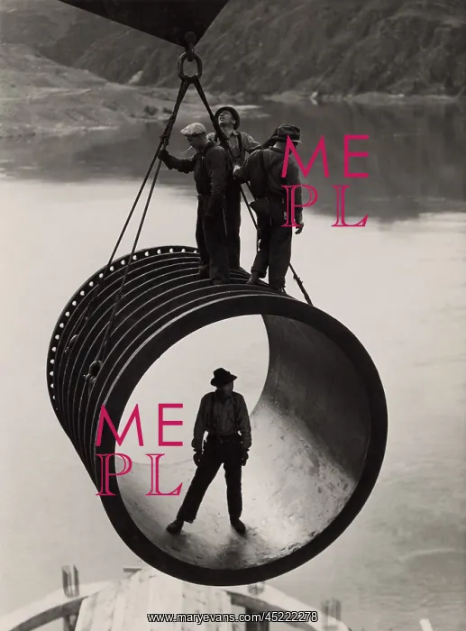 : Four workers riding on a large casing section ? : Four workers riding on a large casing section ?