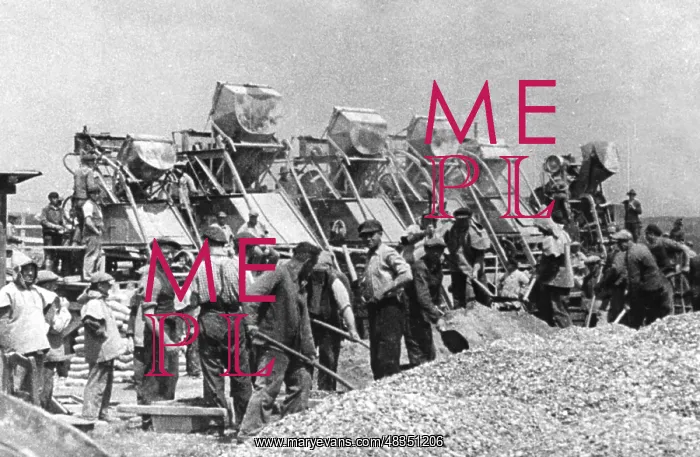 : Workers shoveling gravel : Workers shoveling gravel