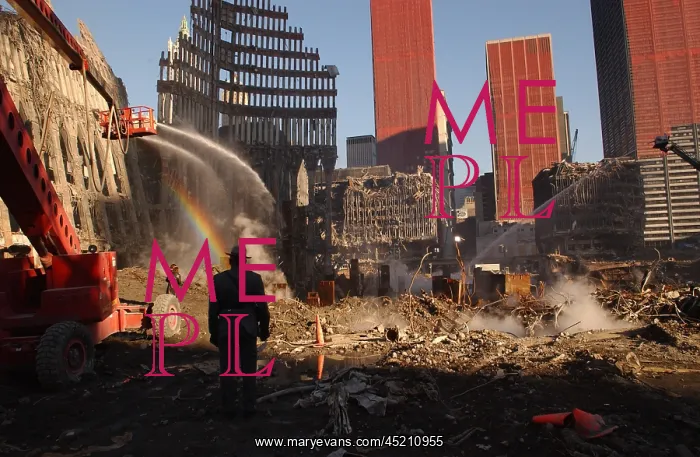 : Workers spray the still smoldering rumble ? : Workers spray the still smoldering rumble ?
