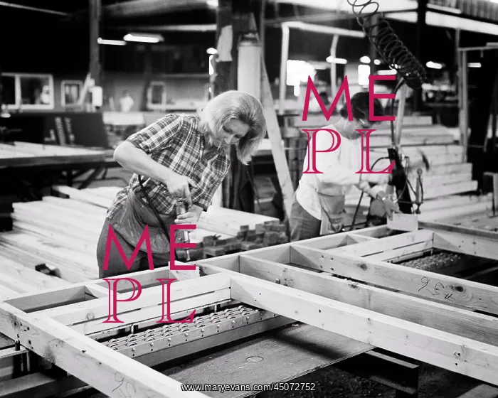 : Two Workers Women on Prefab Factory Floor Assembling a : Two Workers Women on Prefab Factory Floor Assembling a