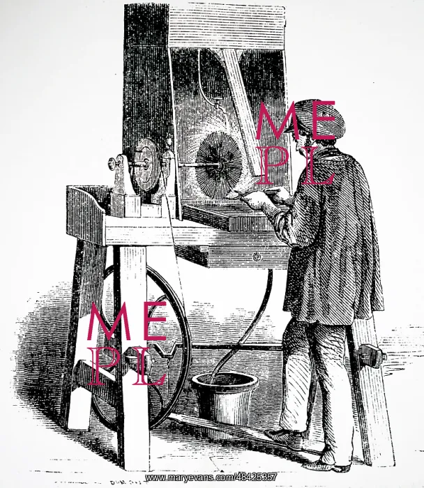 : Workman buffing an electroplated object using : Workman buffing an electroplated object using