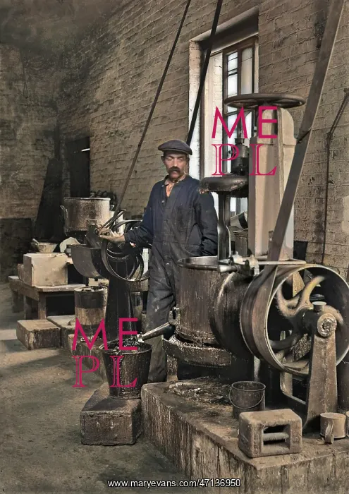 : Workman in a factory operating machinery - lead works : Workman in a factory operating machinery - lead works