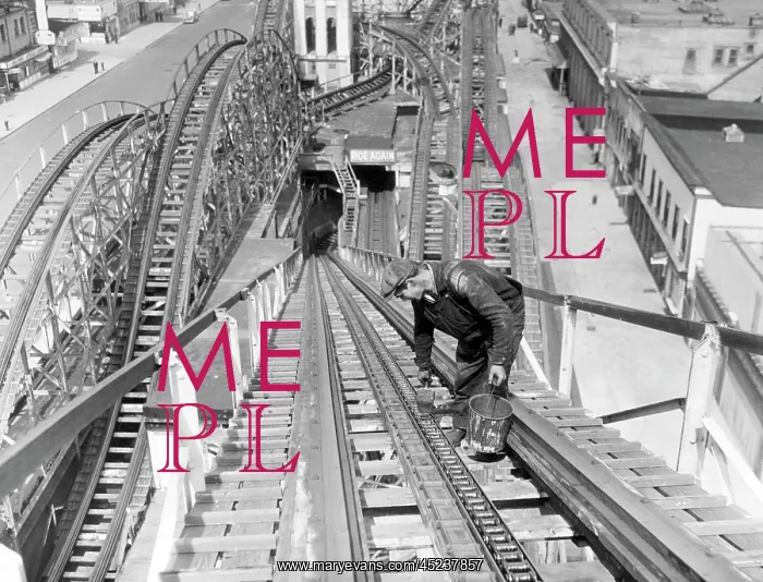 : A workman greases up the tracks of the Cyclone ? : A workman greases up the tracks of the Cyclone ?
