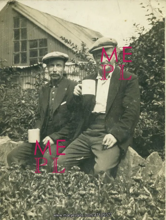  : Workmen. Two working class men enjoying a break from work with a cup of tea