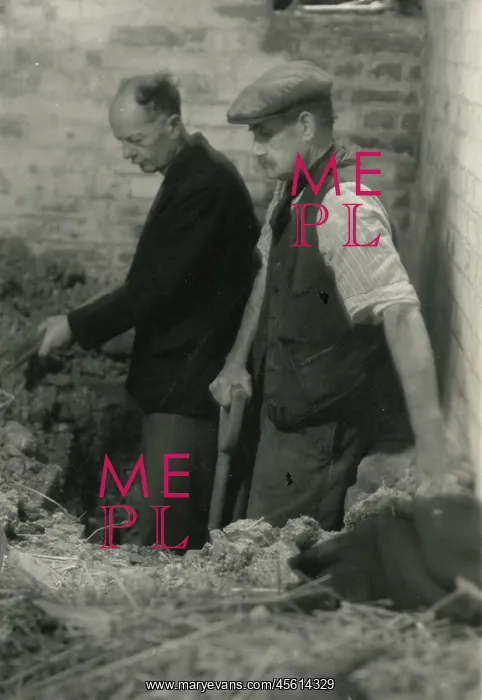 : Workmen digging in the cellar of Borley Rectory : Workmen digging in the cellar of Borley Rectory