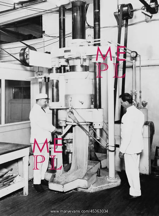 : Workmen operating a spaghetti press at the H.J : Workmen operating a spaghetti press at the H.J