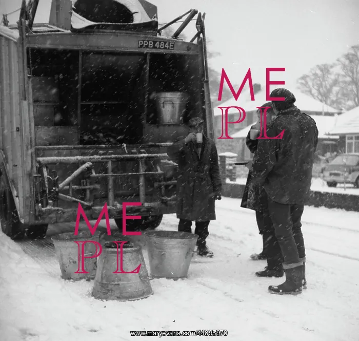 : Three workmen stop for a cup of tea on a snowy day : Three workmen stop for a cup of tea on a snowy day