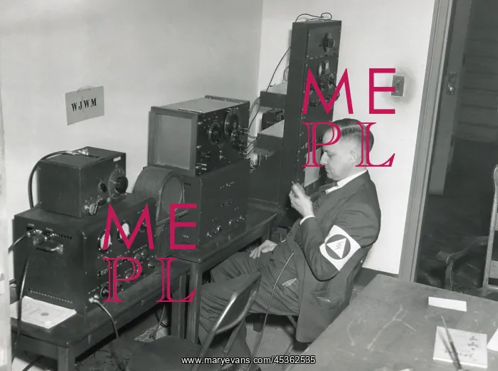 : World War 2 civil defense worker monitors three : World War 2 civil defense worker monitors three