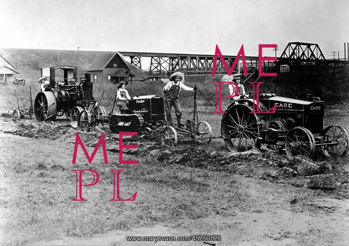 : World War I Farmerettes driving tractors pulling : World War I Farmerettes driving tractors pulling