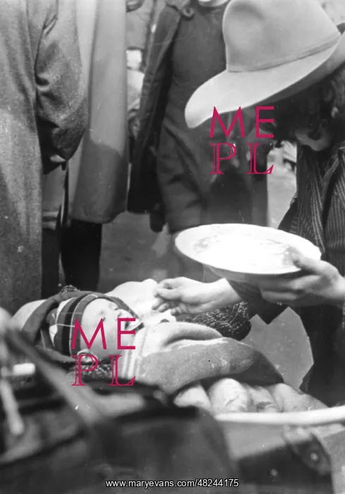 : World War II: Baby while being fed : World War II: Baby while being fed