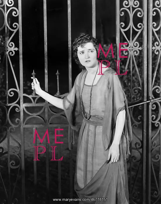 : Worried woman at gate : Worried woman at gate