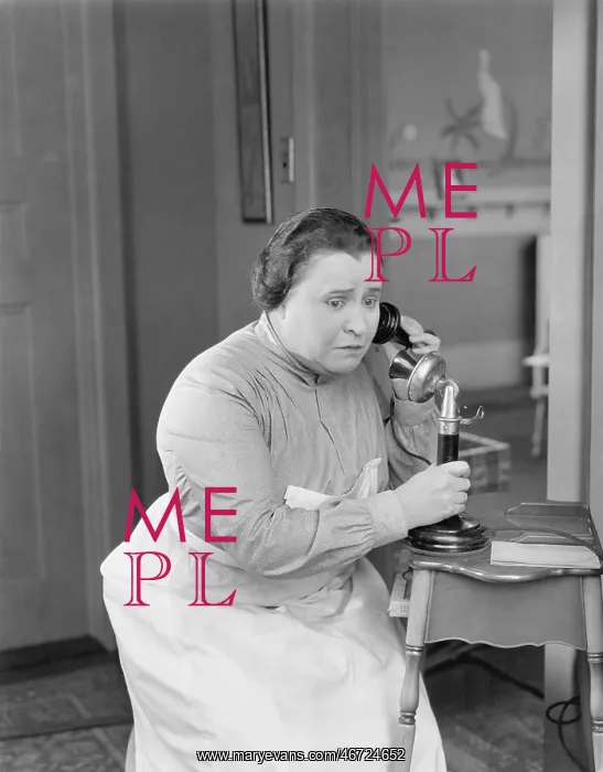 : Worried woman using telephone : Worried woman using telephone