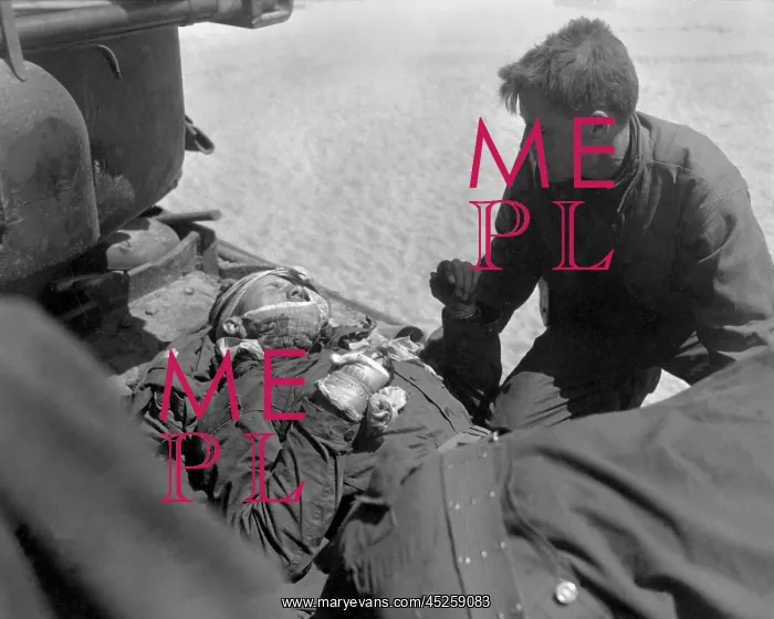 : Wounded, but alert, U.S. soldier in an outboard : Wounded, but alert, U.S. soldier in an outboard