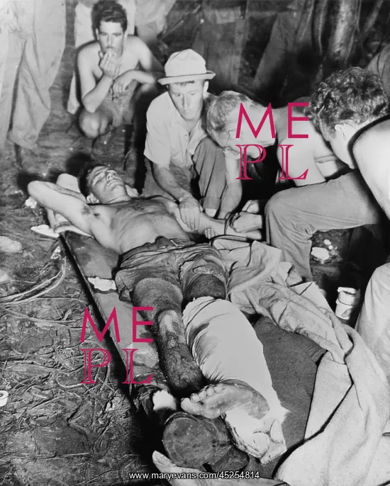: A wounded American soldier gets a blood transfusion : A wounded American soldier gets a blood transfusion