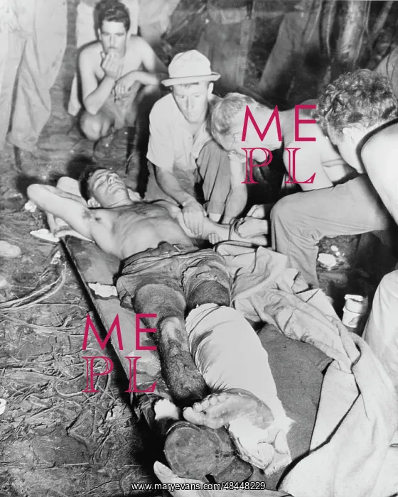 : A wounded American soldier gets a blood transfusion : A wounded American soldier gets a blood transfusion