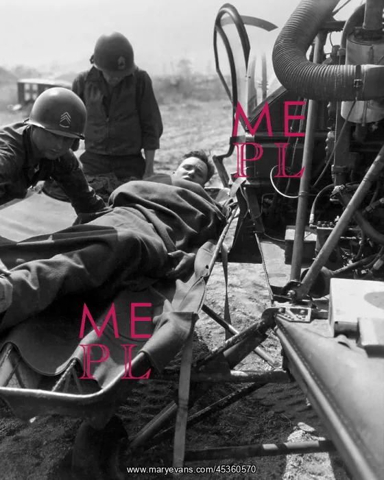 : Wounded U.S. soldier lifted onto a helicopter for : Wounded U.S. soldier lifted onto a helicopter for