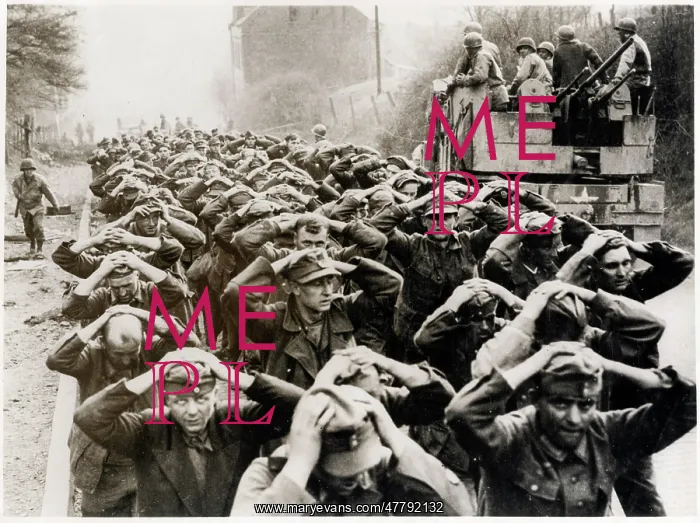 : WW II - German prisoners marching following capture : WW II - German prisoners marching following capture