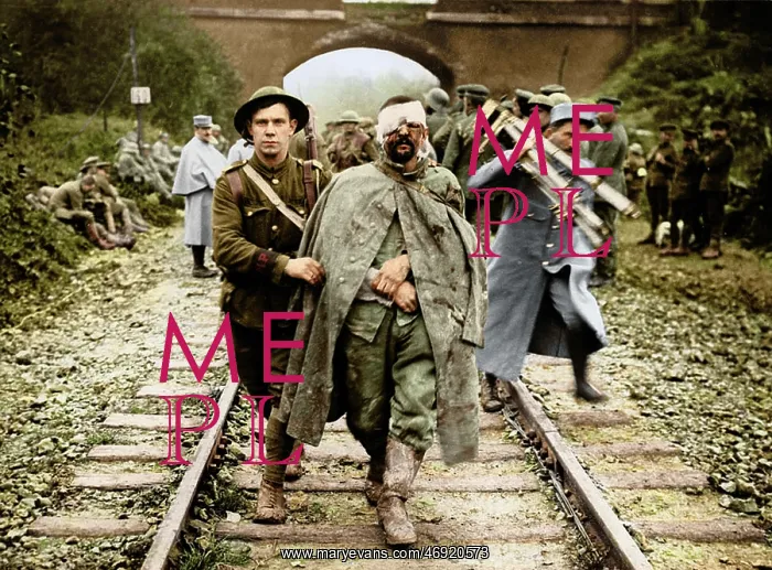 : WW1 100. WW1 - A British soldier helps a wounded German prisoner walk along : WW1 100. WW1 - A British soldier helps a wounded German prisoner walk along