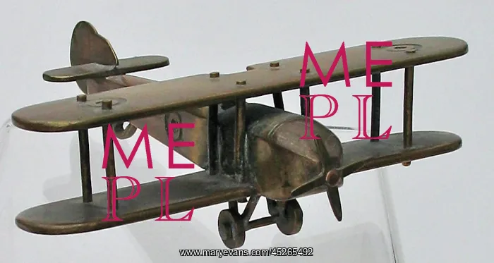 : WWI biplane with machine-made roundels on wings : WWI biplane with machine-made roundels on wings