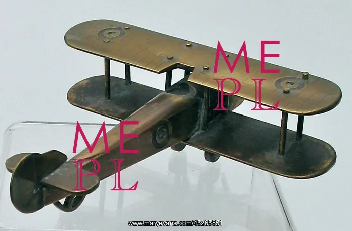 : WWI biplane with machine-made roundels on wings : WWI biplane with machine-made roundels on wings