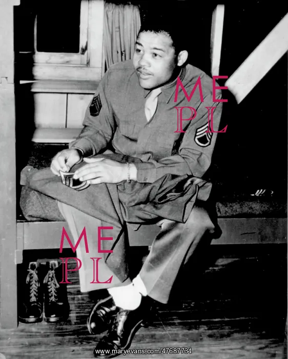 : WWII, Joe Louis Sews On Sergeant Stripes, 1945 : WWII, Joe Louis Sews On Sergeant Stripes, 1945