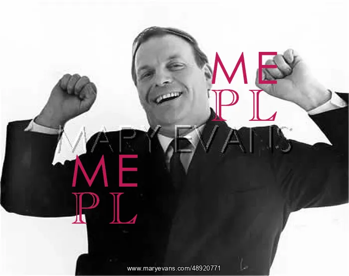  : YAWNING. A man lifts his arms up as he yawns