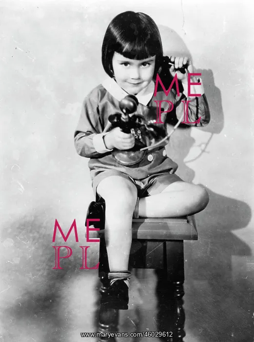 : A four year old girl telphoning : A four year old girl telphoning