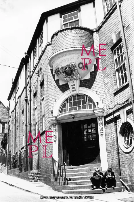 : YMCA building with two boys on the steps : YMCA building with two boys on the steps