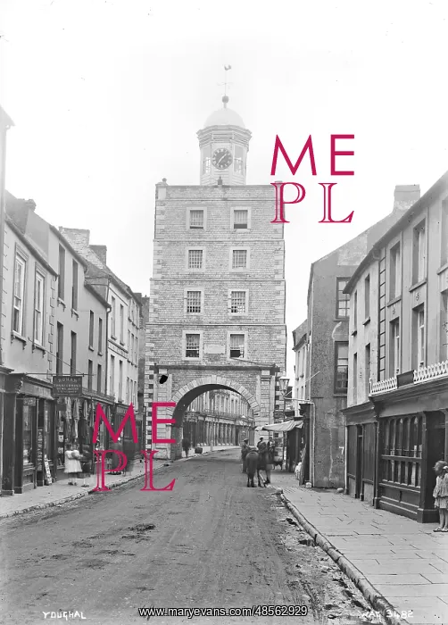 : Youghal - a street scene with shops, people and a horse : Youghal - a street scene with shops, people and a horse