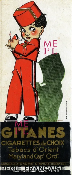: A young bellboy lights up his Gitanes Cigarette : A young bellboy lights up his Gitanes Cigarette