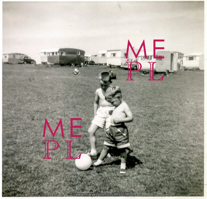 : Young brothers playing with ball at a holiday camp : Young brothers playing with ball at a holiday camp