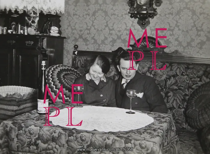 : Young couple on a bed. A table with : Young couple on a bed. A table with