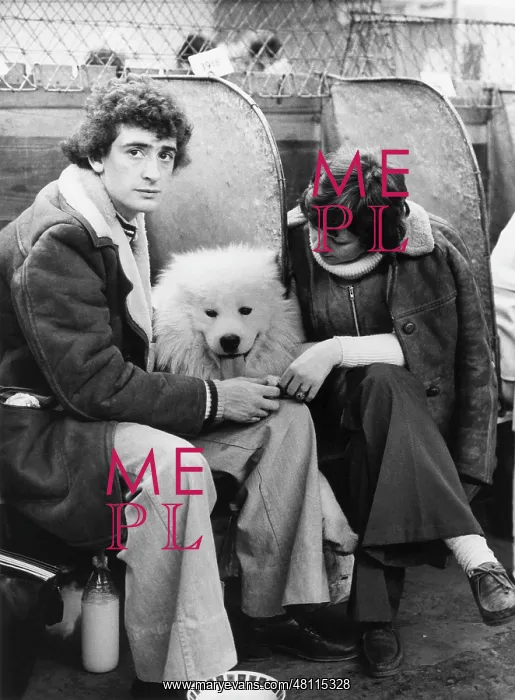 : Young couple and dog at a dog show : Young couple and dog at a dog show