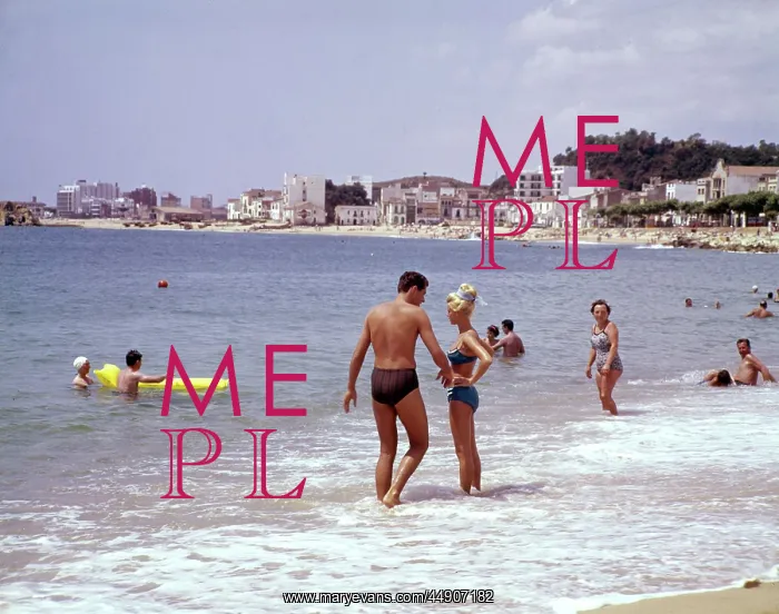 : Young couple standing in the sea, Spain : Young couple standing in the sea, Spain