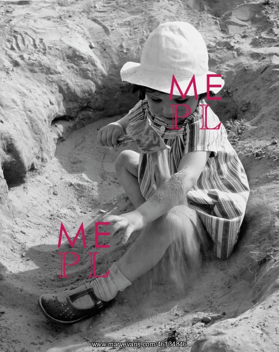 : Young girl playing in sand : Young girl playing in sand