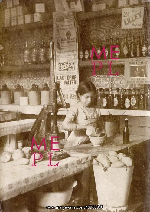 : Young girl preparing chips - Fish & Chip Shop, Morecambe : Young girl preparing chips - Fish & Chip Shop, Morecambe