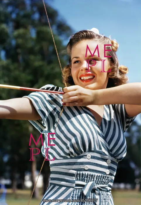 : Young Girl Shooting Bow and Arrow : Young Girl Shooting Bow and Arrow