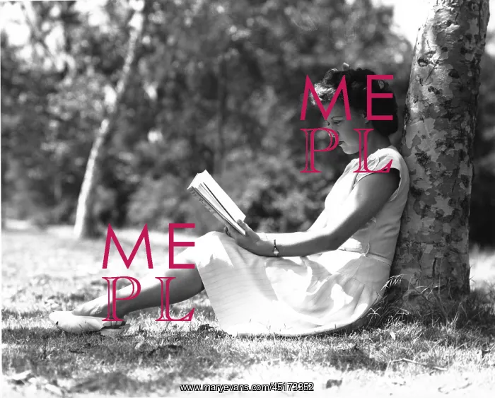 : Young girl sitting under a tree reading : Young girl sitting under a tree reading