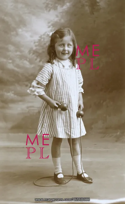 : Young girl with a skipping rope : Young girl with a skipping rope