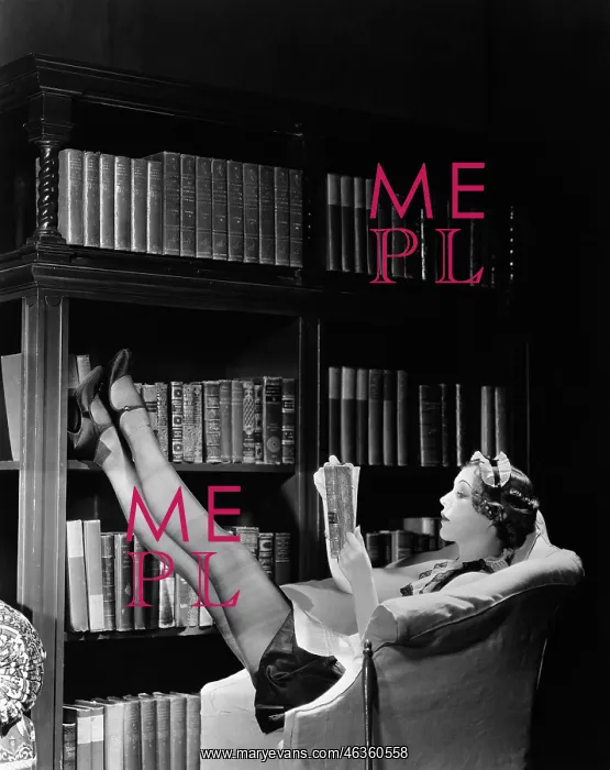 : Young housekeeper reading a book while reclining : Young housekeeper reading a book while reclining
