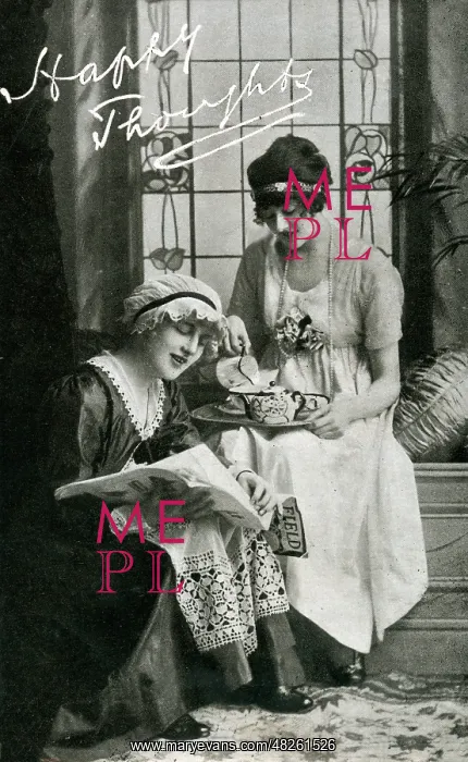 : Two young ladies enjoying a cup of tea : Two young ladies enjoying a cup of tea