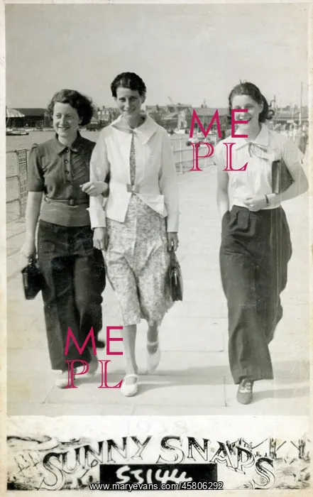 : Three young ladies strolling along the seafront : Three young ladies strolling along the seafront