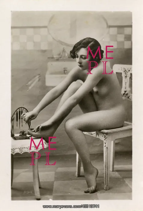 : Young Lady doing a pedicure on herself : Young Lady doing a pedicure on herself