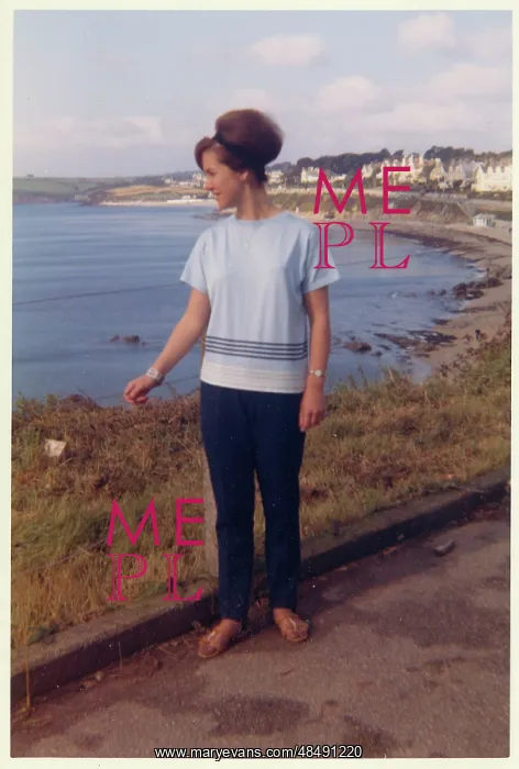 : Young lady on holiday - British coastline : Young lady on holiday - British coastline