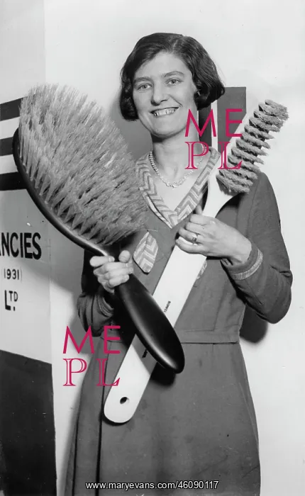 : A young lady shows a giant toothbrush : A young lady shows a giant toothbrush