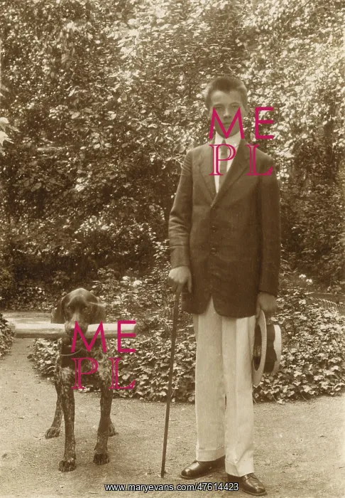  : Young man with a dog in a garden