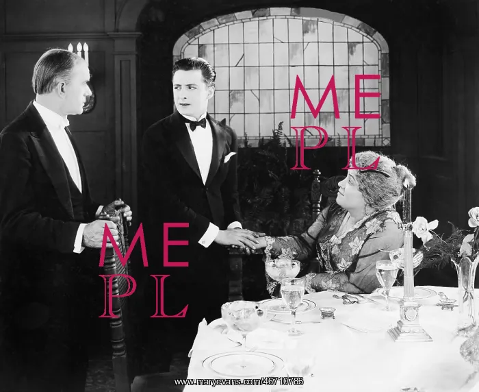 : Young man greeting a couple at the dinner table : Young man greeting a couple at the dinner table