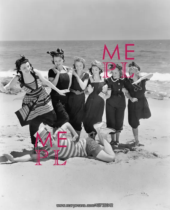: Young man with a group of young women at the beach : Young man with a group of young women at the beach