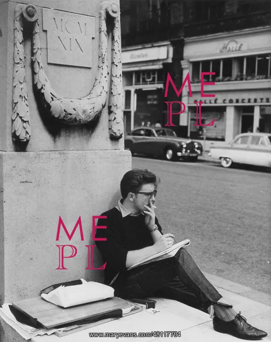 : Young man leaning against a monument, Manchester : Young man leaning against a monument, Manchester